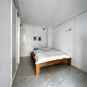 A bed or beds in a room at Bear Holiday - Apartment Maria in Moraira near the Beach Még 18 kép