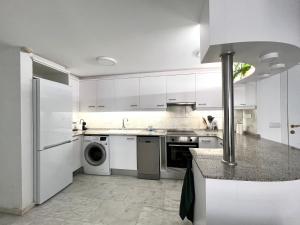 A kitchen or kitchenette at Bear Holiday - Apartment Maria in Moraira near the Beach