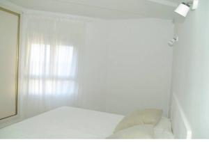 Posteľ alebo postele v izbe v ubytovaní Corralejo vista mar + 2 fotografie