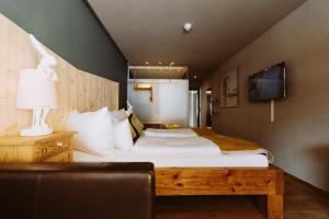 Letto o letti in una camera di Walliserhof