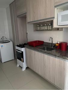 Una cocina o zona de cocina en Condomínio Paraiso dos Coqueiros