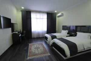 Postel nebo postele na pokoji v ubytování Hotel 777