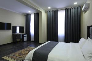 Postel nebo postele na pokoji v ubytování Hotel 777