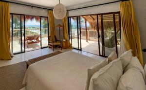 Una cama o camas en una habitación de Dune Boutique Hotel located at the party zone