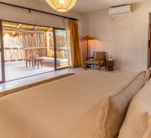 Una cama o camas en una habitación de Dune Boutique Hotel located at the party zone