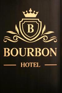 a luxury hotel logo with a crown on top at Bourbon Boutique Hotel in Yerevan