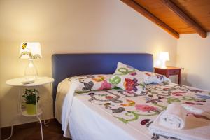 Ένα ή περισσότερα κρεβάτια σε δωμάτιο στο Le Coccole