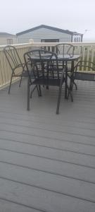 a group of picnic tables on a deck at crimdon dene holiday park in Hartlepool