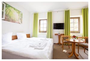Postel nebo postele na pokoji v ubytování Hotel Hähnel