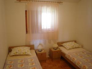 Posteľ alebo postele v izbe v ubytovaní Apartment View Razanac