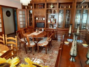 a dining room with a table and chairs at Apartamento AS CARBALLAS in Caldas de Reis