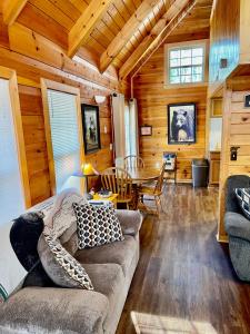 a living room with a couch and a table at Beary Charming in Gatlinburg