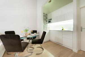 a kitchen with a table and chairs in a room at Apartments Florence - Federighi in Florence