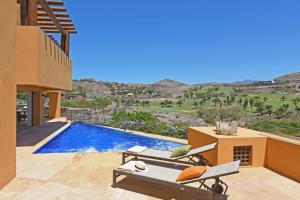 a villa with a view of a swimming pool at Salobre Villa Cardón in Maspalomas