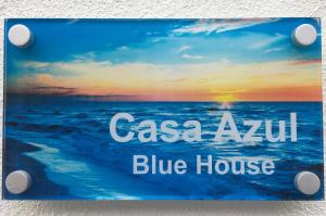 a picture of the ocean with the words casa azul blue house at Alo Baía São Lourenço in Santa Bárbara