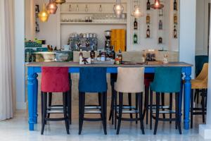 a bar with colorful bar stools around it at EUROPA Hotel in Vasto