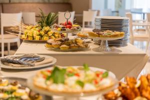 a table with plates of food on top at EUROPA Hotel in Vasto