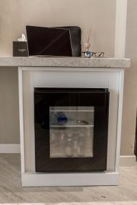 a white fireplace with a marble counter top at EUROPA Hotel in Vasto