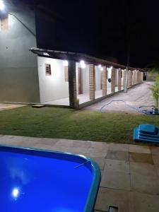 a view of a house at night with lights at Vila São Miguel in Fortim