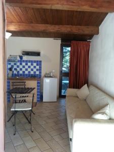 a living room with a couch and a table at Al Settimo Cielo in Montenero di Bisaccia