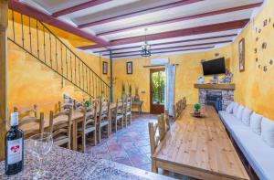a dining room with a table and chairs and a fireplace at El Mirador De Ruidera in Ruidera +167 photos