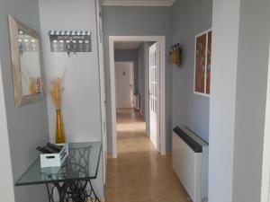 A television and/or entertainment centre at Bonito piso a de Candela en O Grove