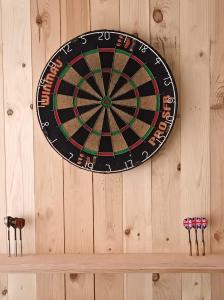 a dart board on a wooden wall at Zus of So in Ostend