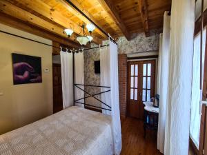 Postel nebo postele na pokoji v ubytování El Molino de la Ropería
