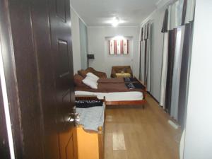 Postel nebo postele na pokoji v ubytování Guest House R&T
