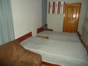 Postel nebo postele na pokoji v ubytování Guest House R&T