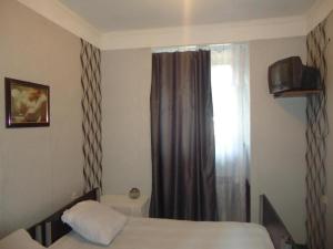 Postel nebo postele na pokoji v ubytování Guest House R&T