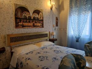 A bed or beds in a room at D'Elite Room & Breakfast