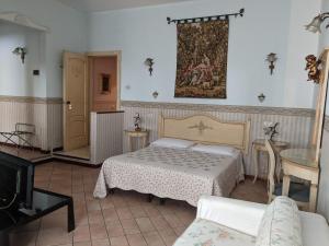 A bed or beds in a room at D'Elite Room & Breakfast