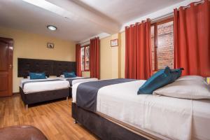 Uma cama ou camas num quarto em Ayenda Posada Inn