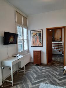 TV a/nebo společenská místnost v ubytování Ferienwohnung Langenberg Altstadt WiFi Netflix