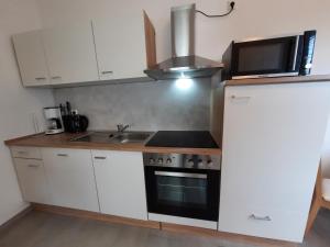 Kuchyň nebo kuchyňský kout v ubytování Ferienwohnung Langenberg Altstadt WiFi Netflix