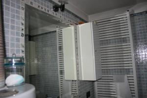 a bathroom with a mirror and a sink and a shower at Casa dell' Abbondanza B&B Agriturismo in Vigoleno