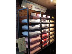 a bunch of towels on a rack in a store at Grand Central Hotel - Vacation STAY 19600v in Tokyo
