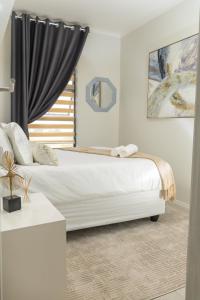 Ένα ή περισσότερα κρεβάτια σε δωμάτιο στο Fumo House Lifestyle Apartments
