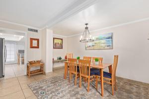 a dining room and kitchen with a table and chairs at Desert Rose Villas - Spotless Three Bedroom Villa in the Heart of Scottsdale in Scottsdale
