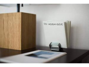 a desk with a phone and a box on it at halettohouse KOSHIGOE - Vacation STAY 30115v in Kamakura
