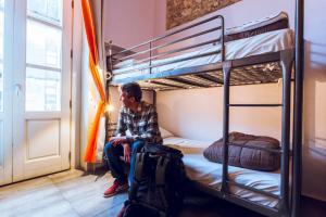 A bed or beds in a room at LoL Hostel Siracusa