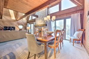 a dining room with a wooden table and chairs at Spacious Syracuse Getaway with Waterfront Deck! in Syracuse