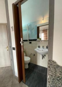 a bathroom with a toilet and a sink at Homelink Firenze - The Key in Florence +16 photos
