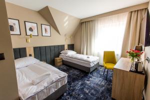 מיטה או מיטות בחדר ב-Motel Zodiak