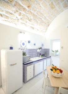 Kuchyň nebo kuchyňský kout v ubytování BLU MARE suite privata & apartment