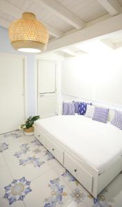 Postel nebo postele na pokoji v ubytování BLU MARE suite privata & apartment