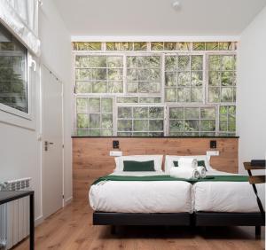 Кровать или кровати в номере Bailén Green House