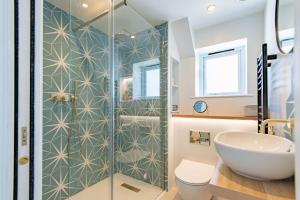 a bathroom with a shower and a sink at Wheelwrights Cottage by Bloom Stays in Staple Cross
