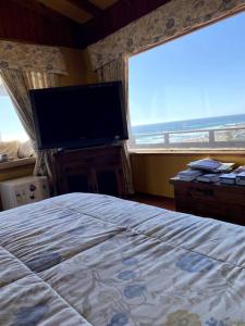 Uma cama ou camas num quarto em Linda casa frente a la playa, Maitencillo, Reservar con más de un día de anticipación